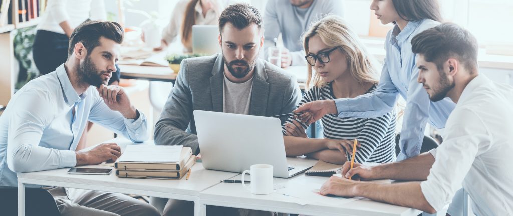 A group of young professional working on computer