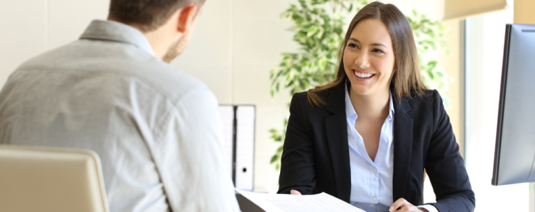 Lady smiling with interview paper